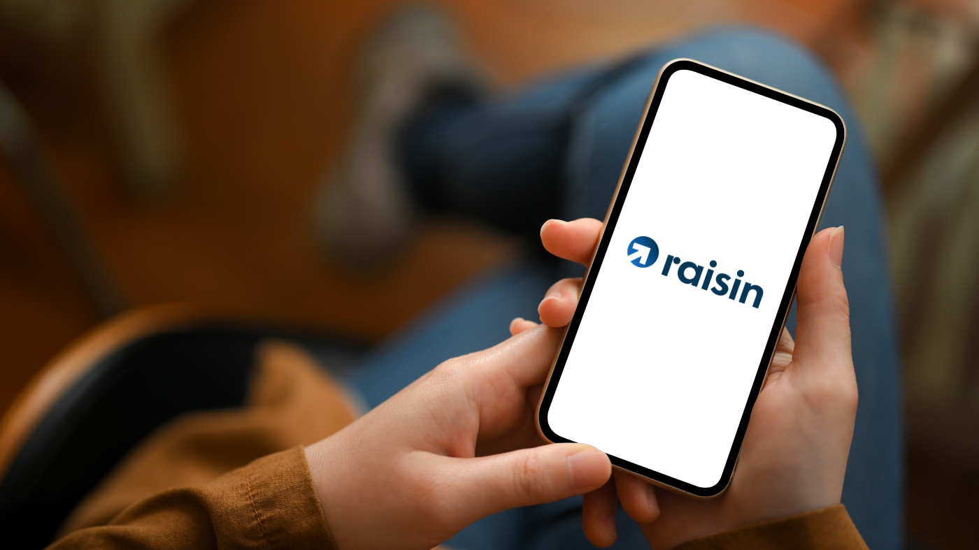 A phone with the Raisin logo