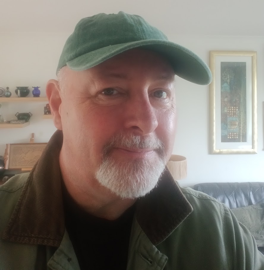 Man with green cap and grey beard