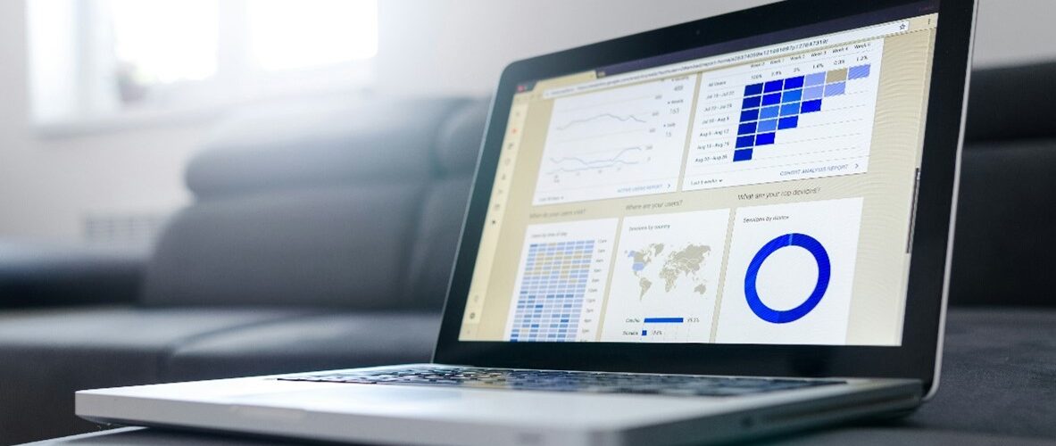 A laptop showing imagery associated with market trends reports